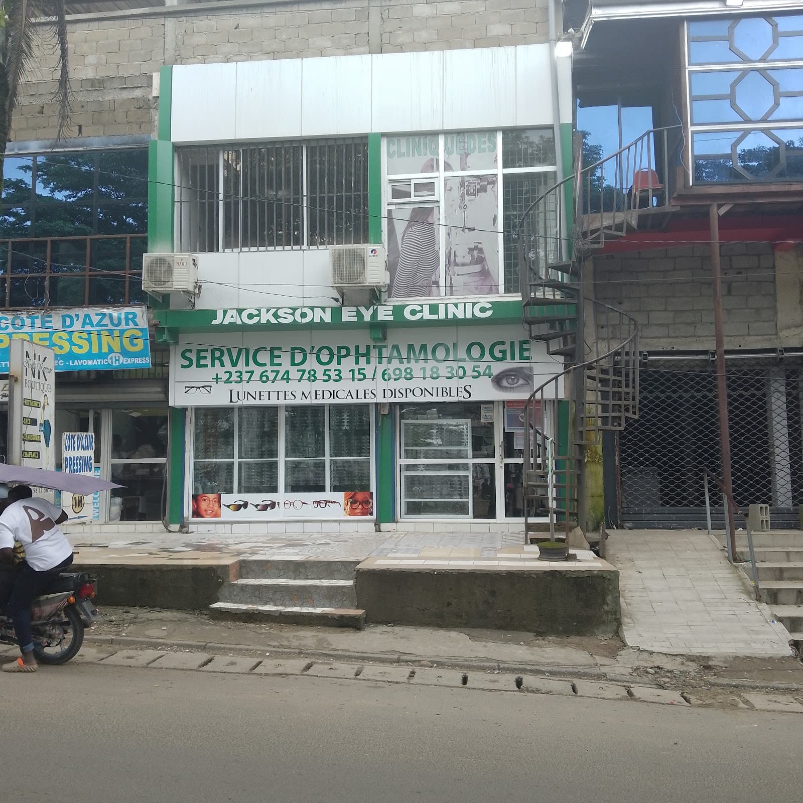 The green shopfront of Jackson Eye Clinic in Kotto